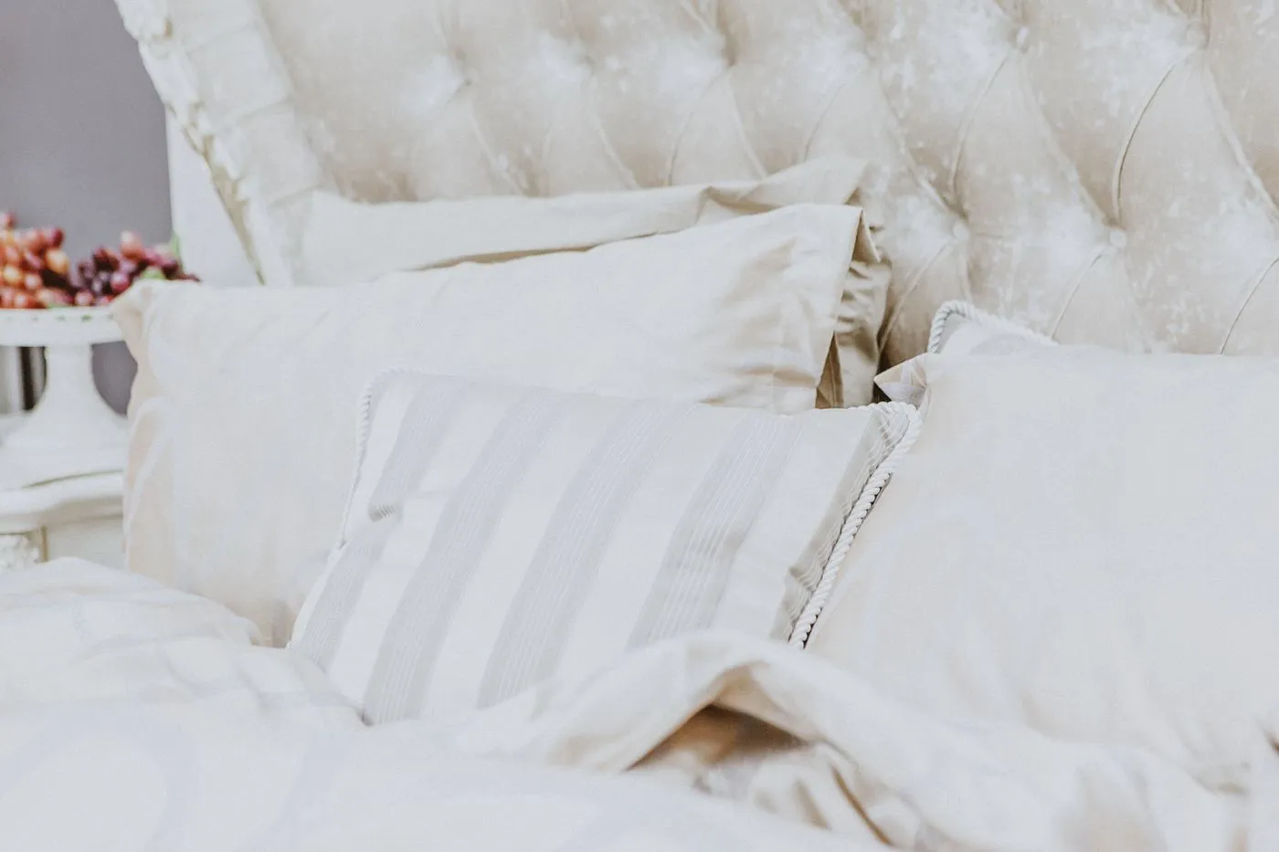 White pillows and a soft blanket on a bed