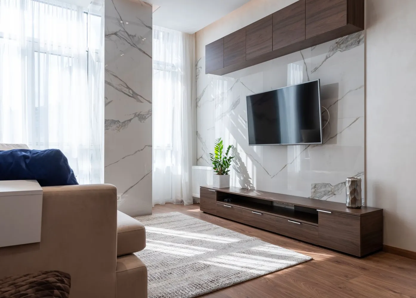 Living room with wooden furniture and a comfortable sofa